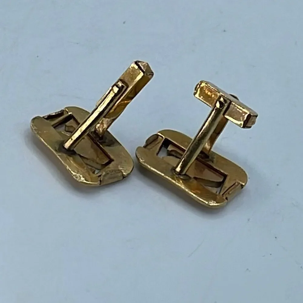 Vintage Anson gold tone shiny matte open design cufflinks.